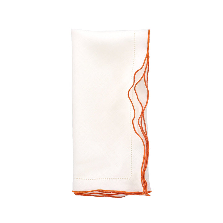 White linen napkin with orange ruffled hemstitch edge stitching, folded rectangle