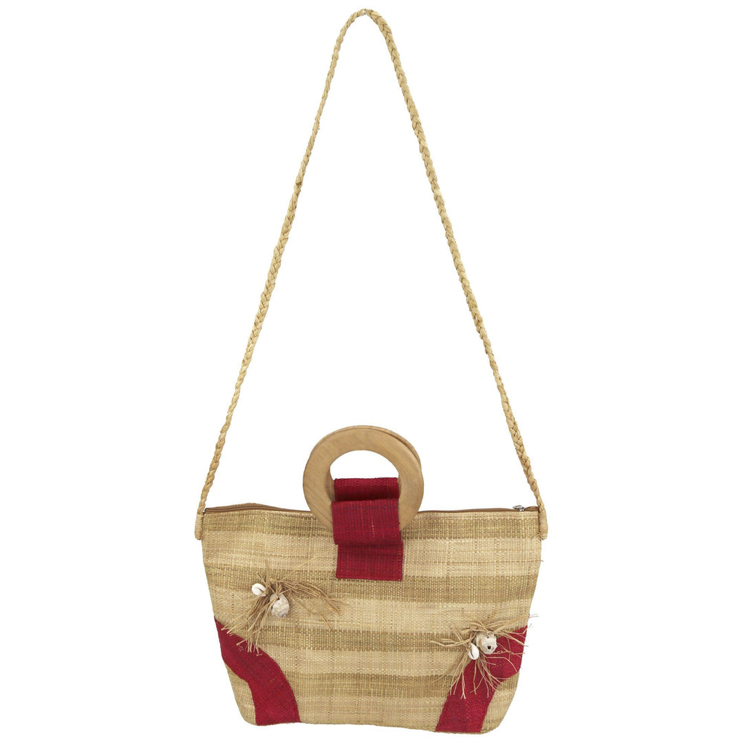 Small raffia tote bag with red panel accents and long rope shoulder handles.