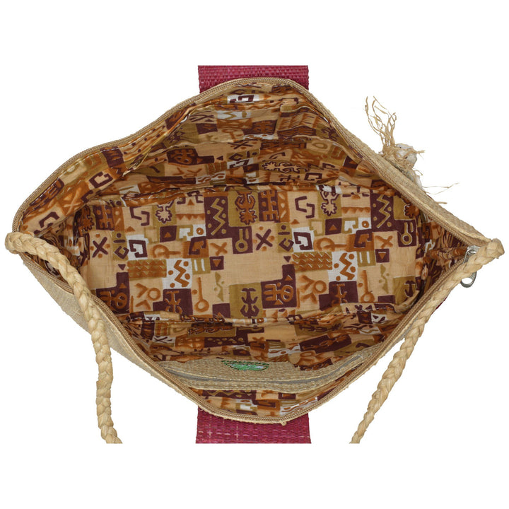 Raffia tote bag interior with patterned fabric lining and rope handle edges.