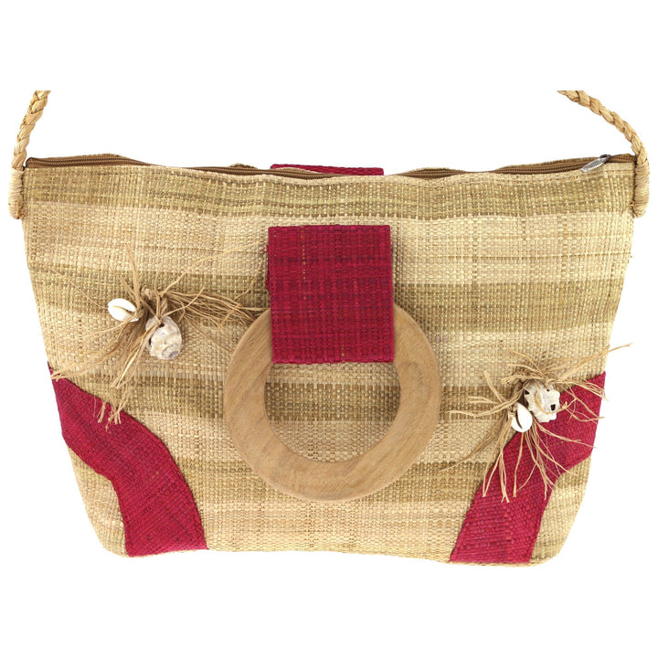 Raffia tote bag front panel with red center detail, shell charms, and fringe trim.