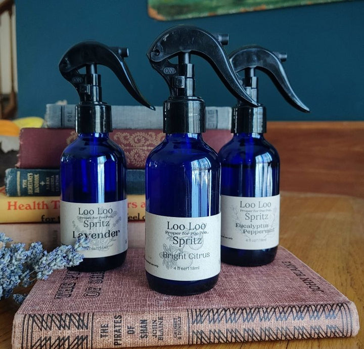 Deodorizing bathroom spray set of 3 blue bottles with black triggers, Lavender and Citrus.
