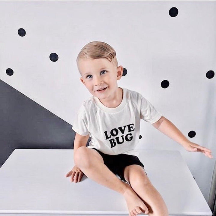 Off-white kids organic T-shirt with "LOVE BUG" black print and crew neck
