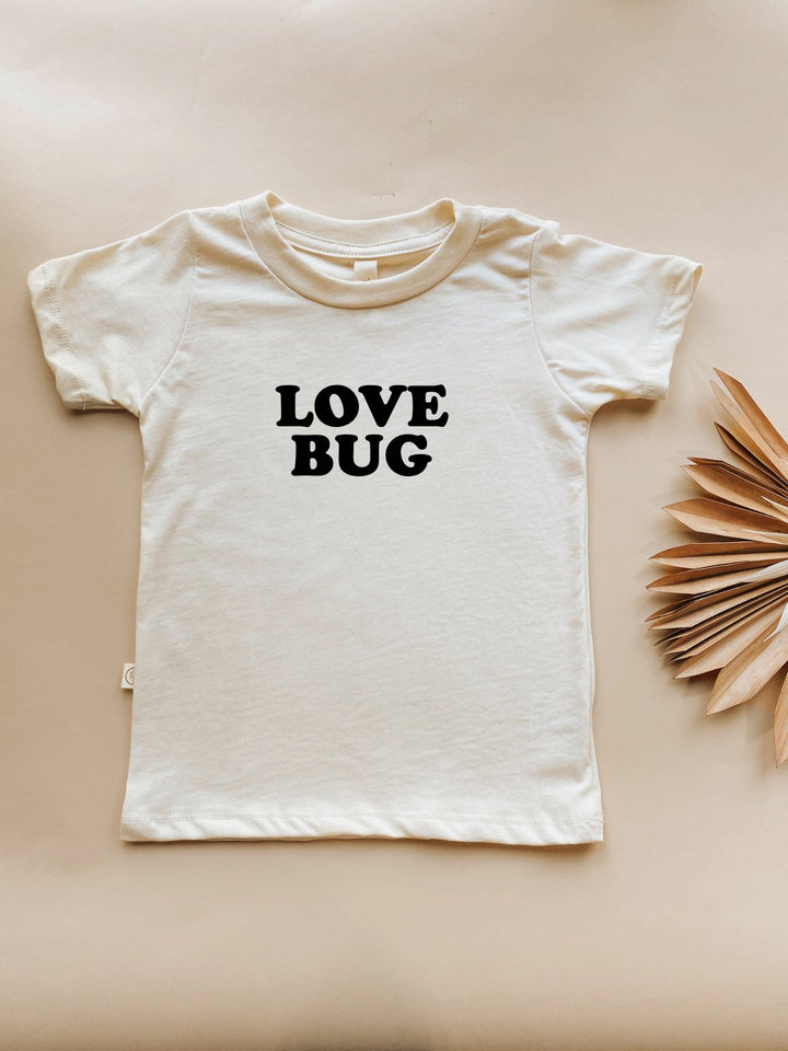 Off-white kids organic T-shirt with "LOVE BUG" black chest graphic