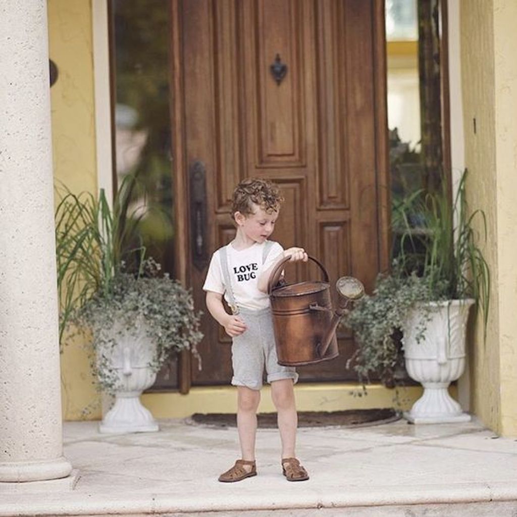 Off-white kids organic T-shirt with "LOVE BUG" front graphic