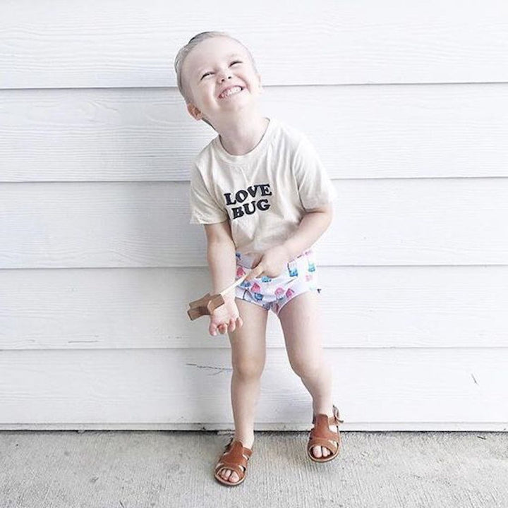 Off-white kids organic T-shirt with "LOVE BUG" front print, crew neck
