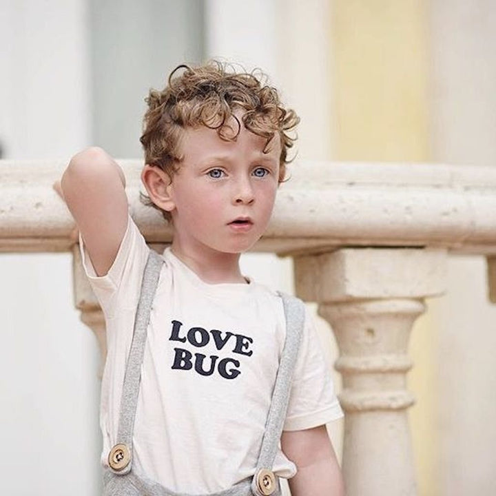 Off-white kids organic T-shirt with "LOVE BUG" black text print