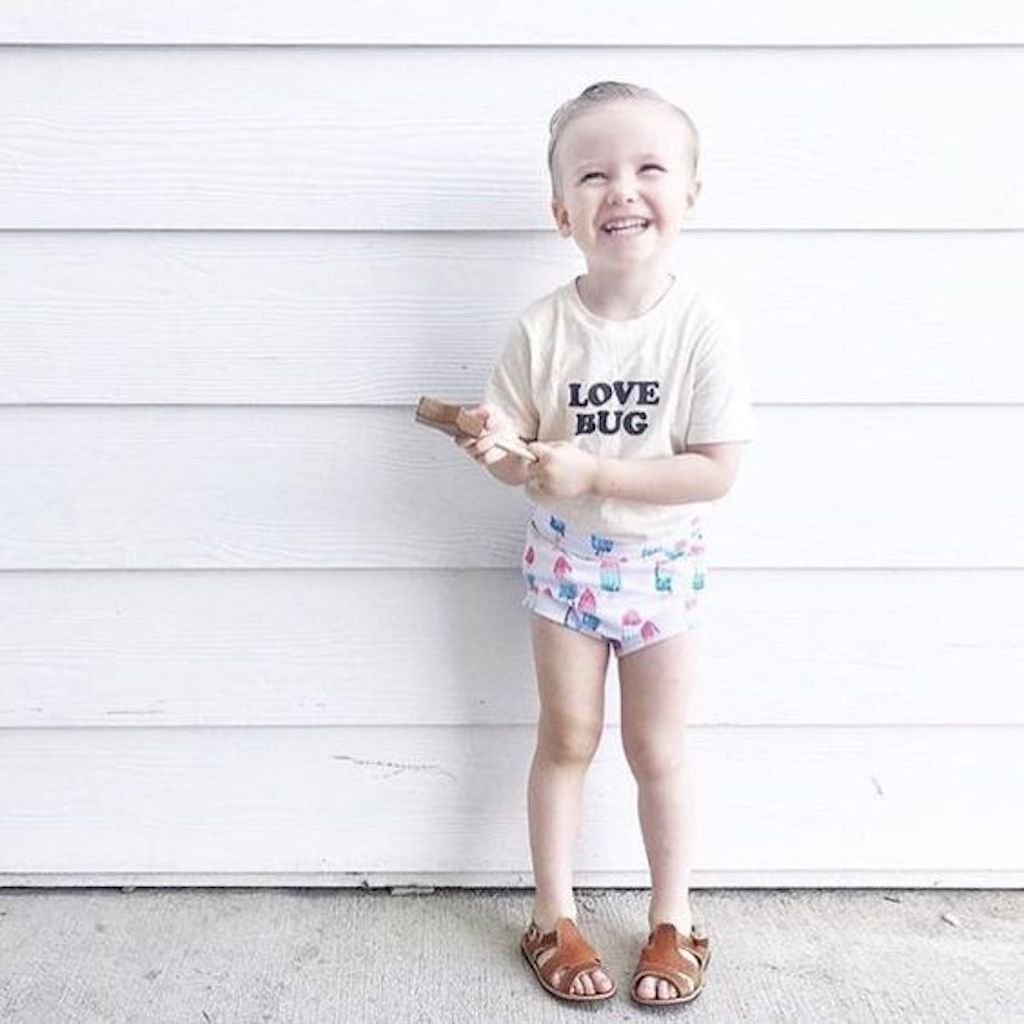 Off-white kids organic T-shirt with "LOVE BUG" front print on child