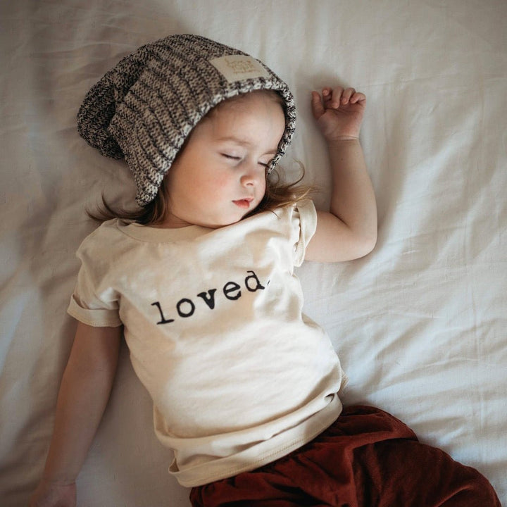 Kids organic T-shirt with “loved.” printed front and crew neckline