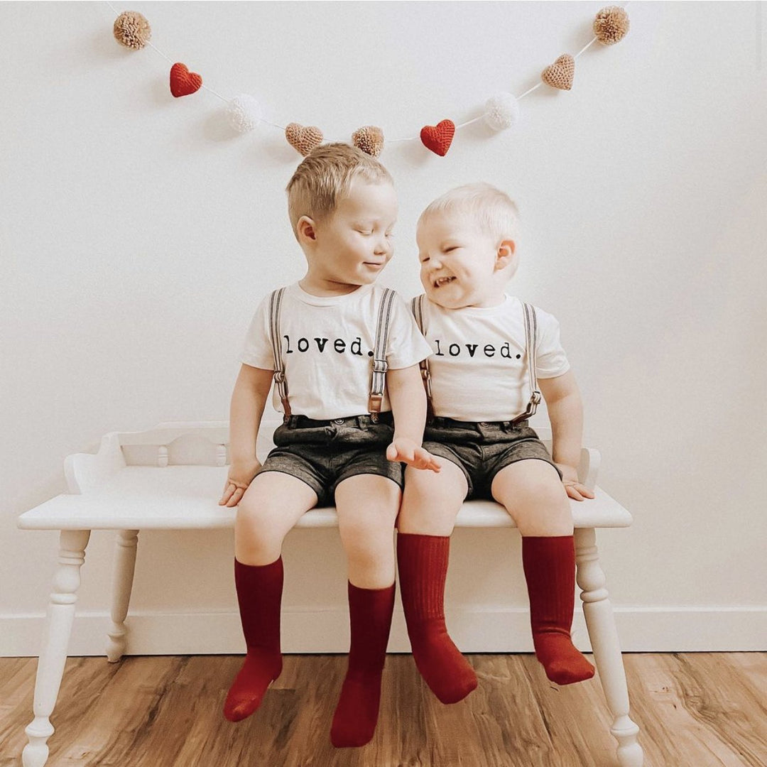 Kids organic T-shirt with “loved.” print on chest, short sleeves