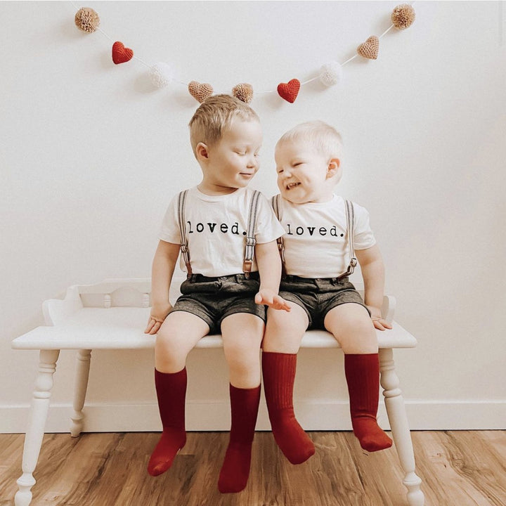 Kids organic T-shirt with “loved.” print on chest, short sleeves