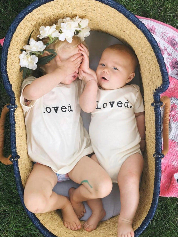 Kids organic T-shirt pair with “loved.” text print on front