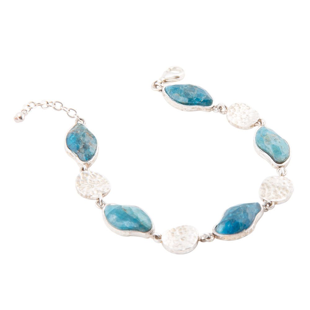 Sterling silver line bracelet with blue apatite oval stones and textured round bead links