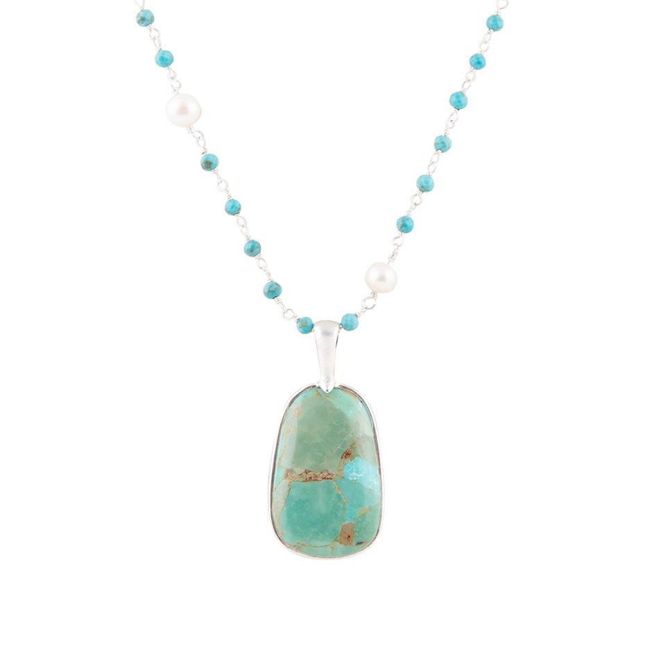 Turquoise bead drop pendant necklace with oval stone pendant in sterling silver frame