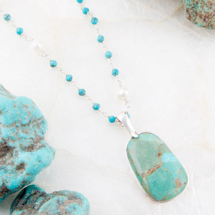 Turquoise and pearl beaded necklace with oval turquoise-look pendant and silver bail