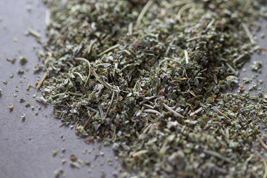 Mediterranean Mountain herbal tea blend: loose dried herbs mound on tray.