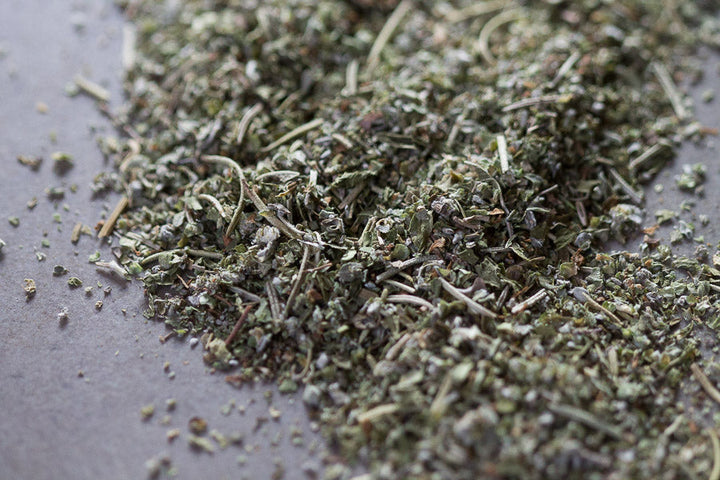 Mediterranean Mountain herbal tea blend: loose dried herbs mound on tray.