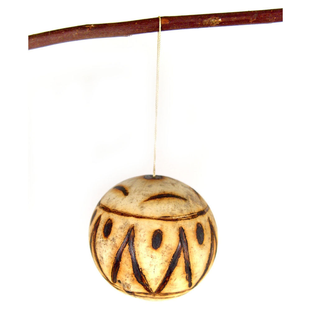 Marula fruit ornament: single round carved wooden bauble with carved leaf-like pattern