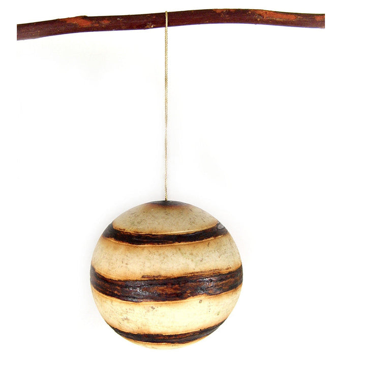 Marula fruit ornament: single round carved wooden bauble with dark horizontal stripe bands