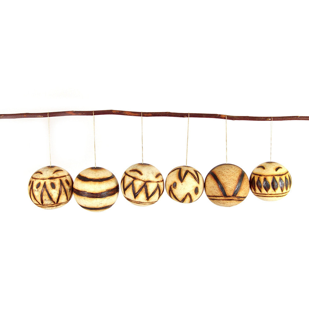 Marula fruit ornament set of round carved wooden baubles with tribal stripe and dot patterns