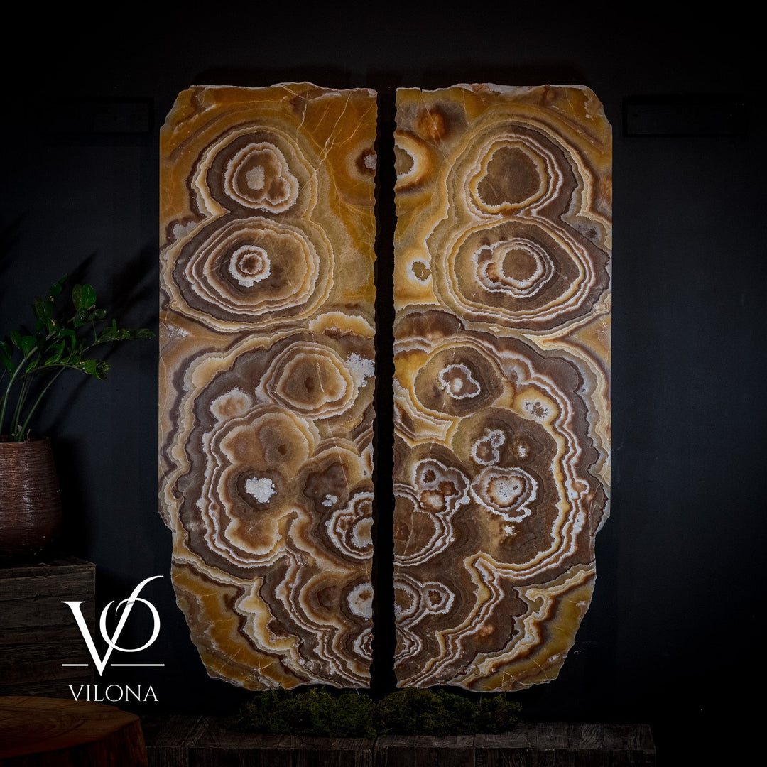 Onyx wall panel set with paired panels showing ringed onyx pattern in tan and brown.