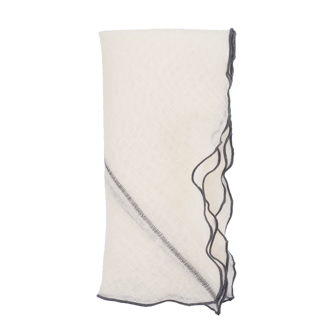 Off-white linen napkin with charcoal stitched edge and ruffled border, folded