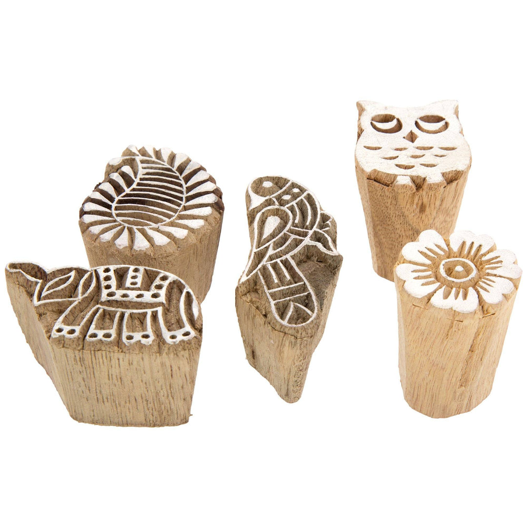 Assorted wooden mini stamps with owl, leaf, and flower motifs