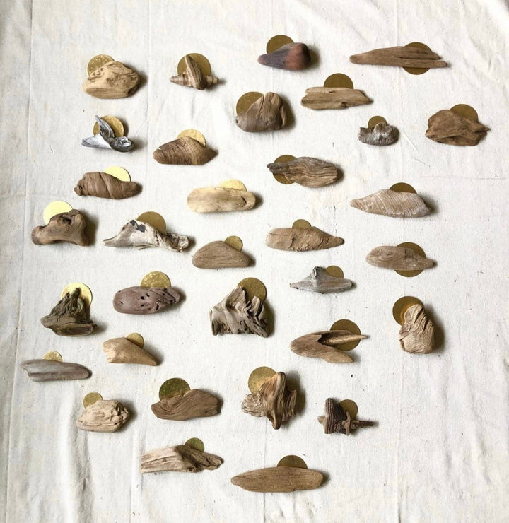 Driftwood-style magnet set, assorted natural wood shapes and tones on display.