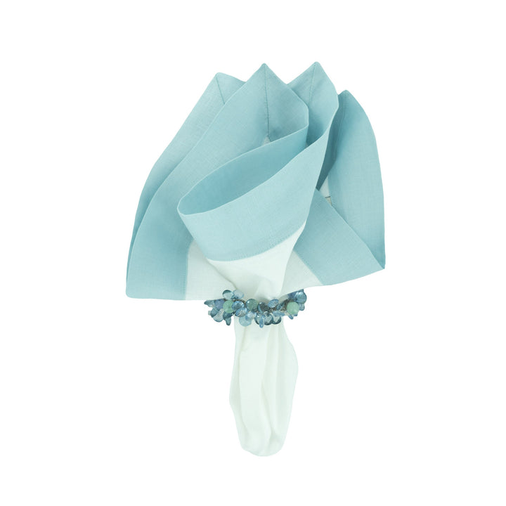 Mint linen napkins folded and tied with a matching band, square bundle