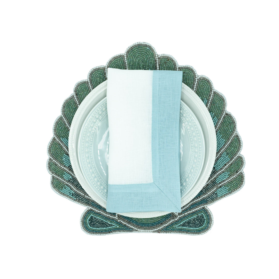 Mint linen napkin folded upright with light green border panel