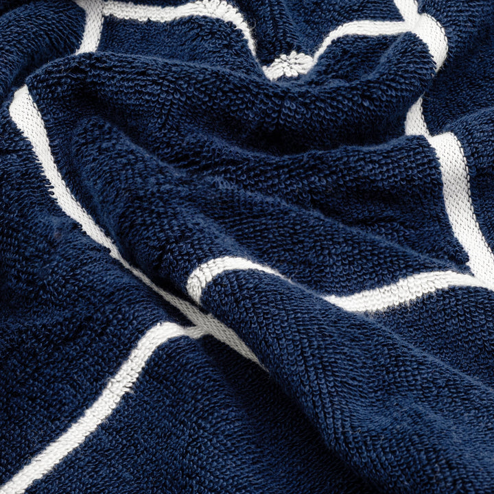 Navy terry cotton towel fabric with raised white stripe pattern