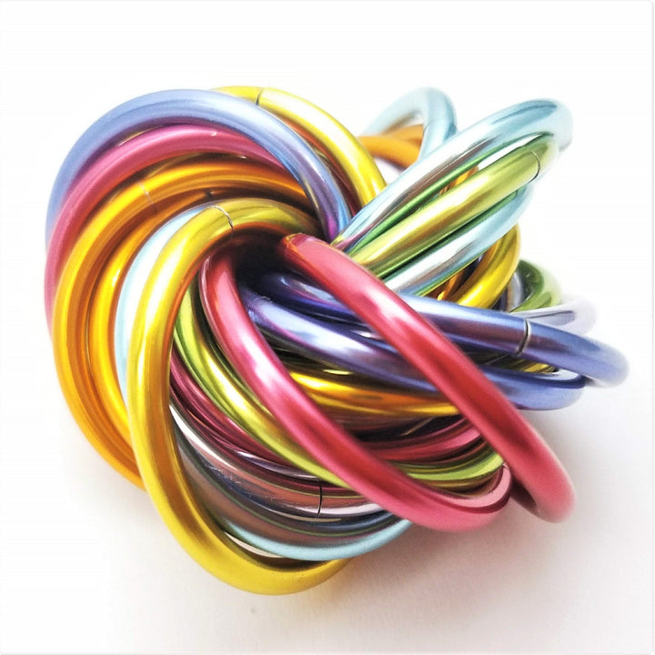Shiny multicolor fidget stress ball with glossy rainbow metal coil loops