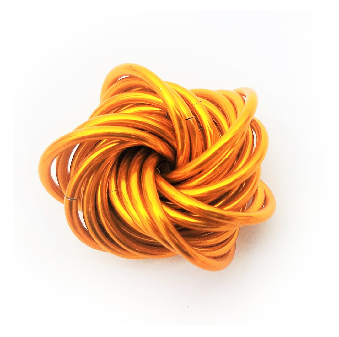 Orange metallic stress fidget ball with coiled loop design