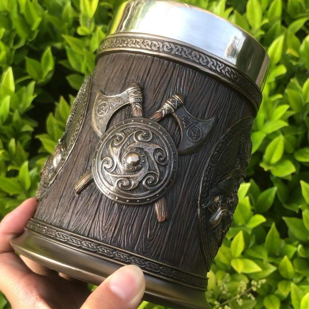 Close-up Viking tankard mug with embossed seal emblem and stainless steel rim