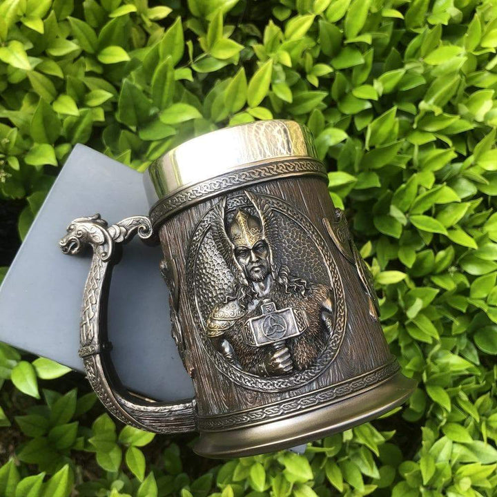 Engraved Viking tankard mug with wide handle and metallic band on top