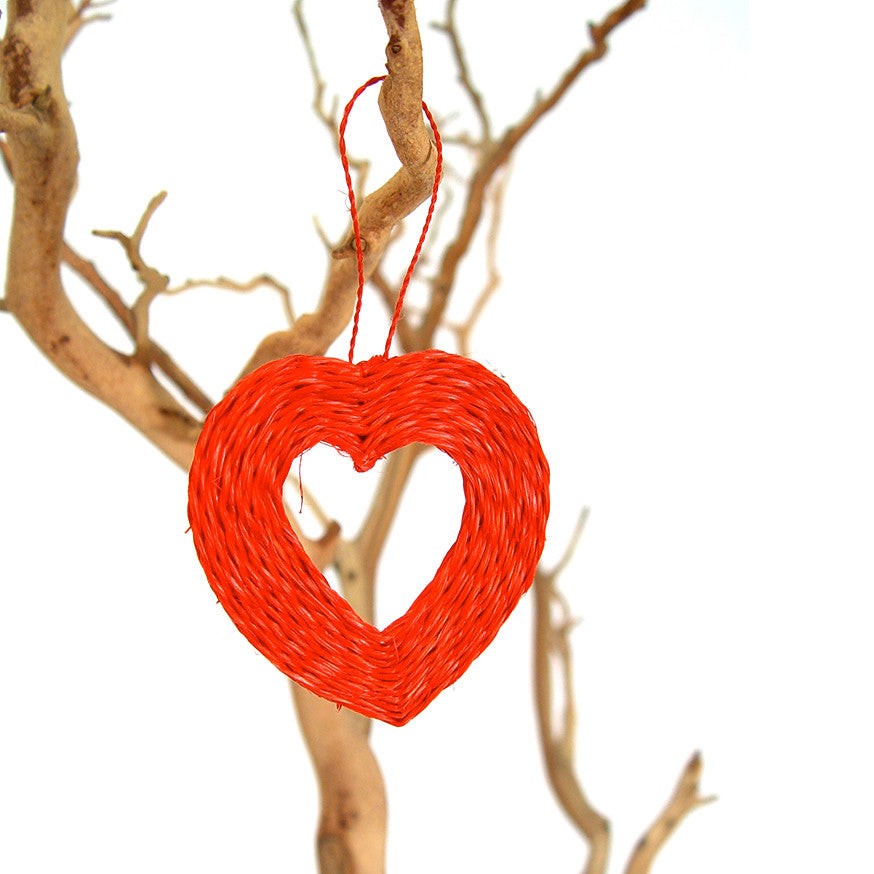Red heart-shaped woven ornament hanging from a loop