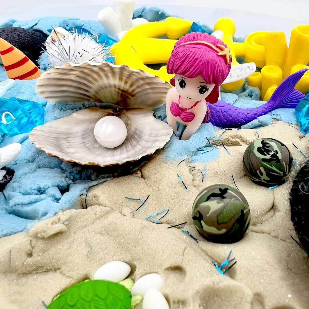 Mermaid kinetic sand play set with small mermaid doll, seashells, and accessories