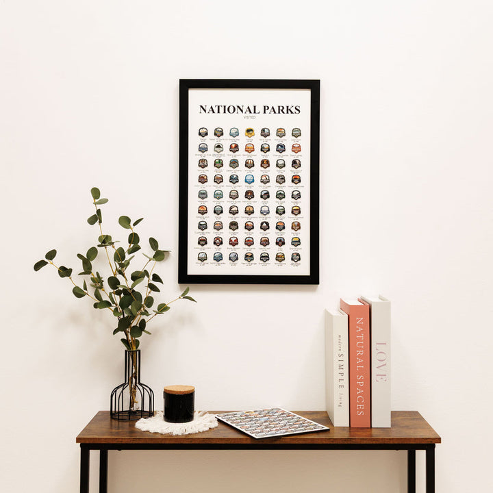 Framed national parks tracker poster with badge icon grid in a black frame