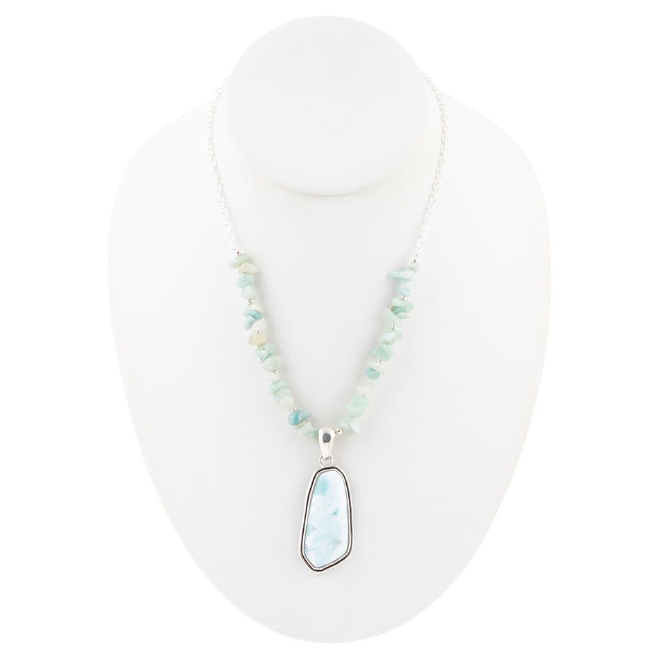 Sterling silver bead necklace with oval light-blue pendant shown on mannequin bust