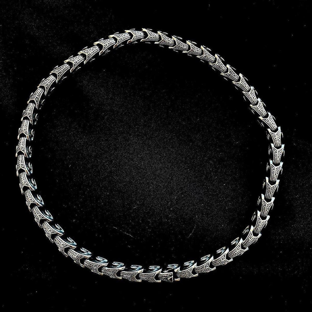 Ornate stainless steel chain necklace, full round view with engraved links