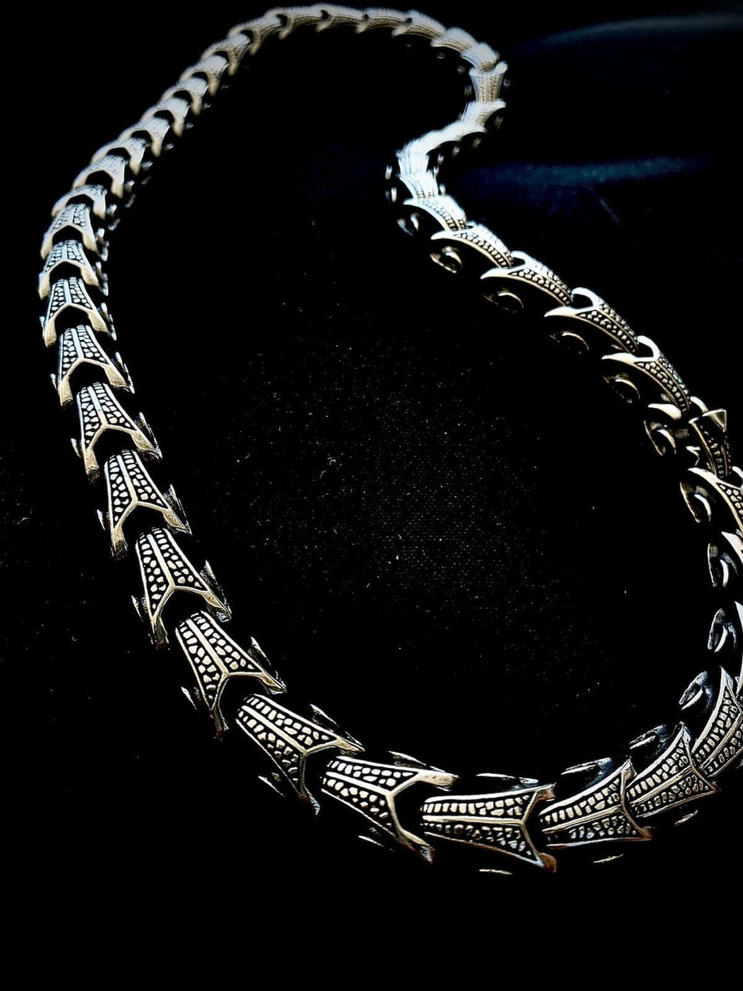 Ornate stainless steel chain necklace with decorative geometric link panels