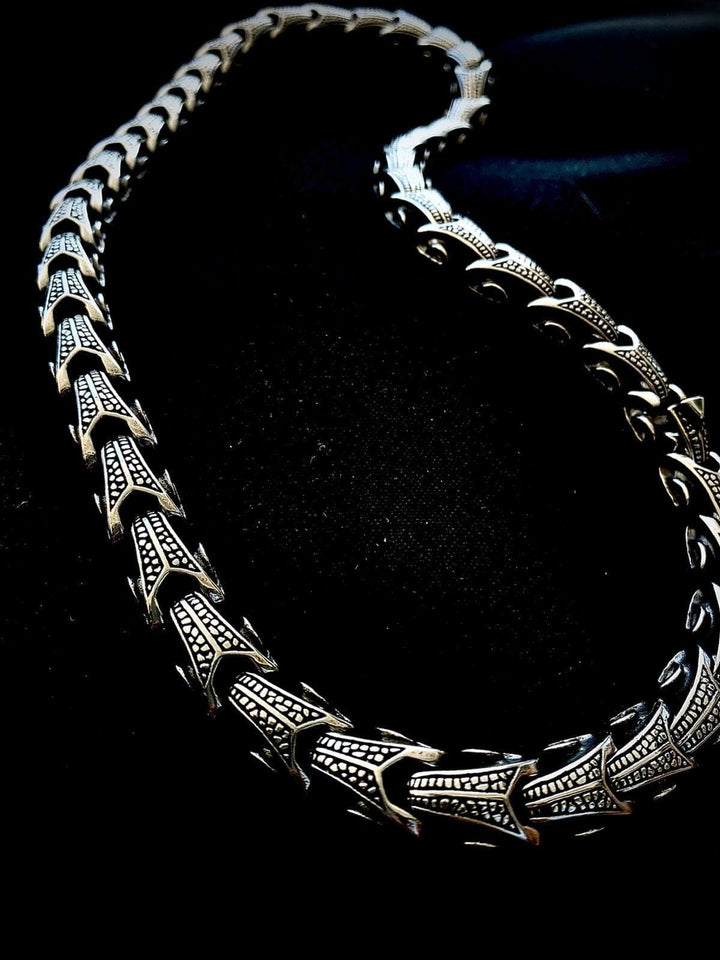 Ornate stainless steel chain necklace with decorative geometric link panels
