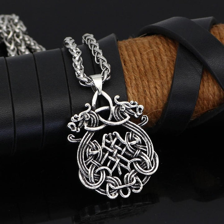 Celtic-style dragon knot pendant necklace in polished stainless steel with link chain.