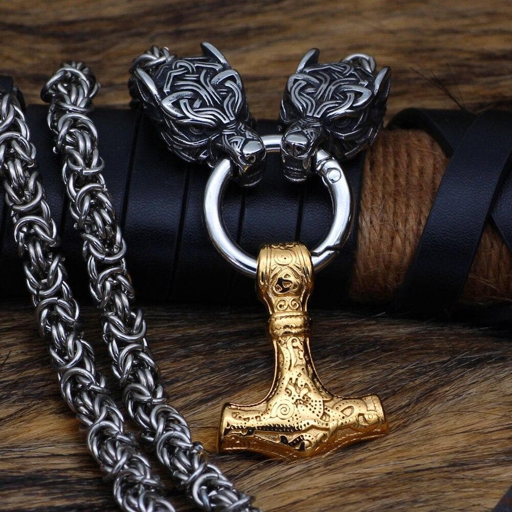 Gold-plated chain necklace with wolf-head clasp and hammer pendant detail