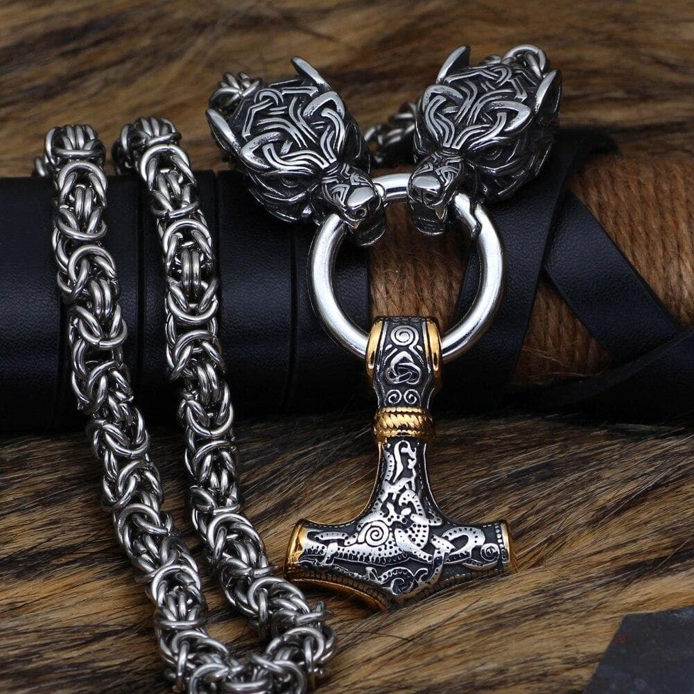 Silver chain necklace with wolf-head clasp and mixed-metal hammer pendant