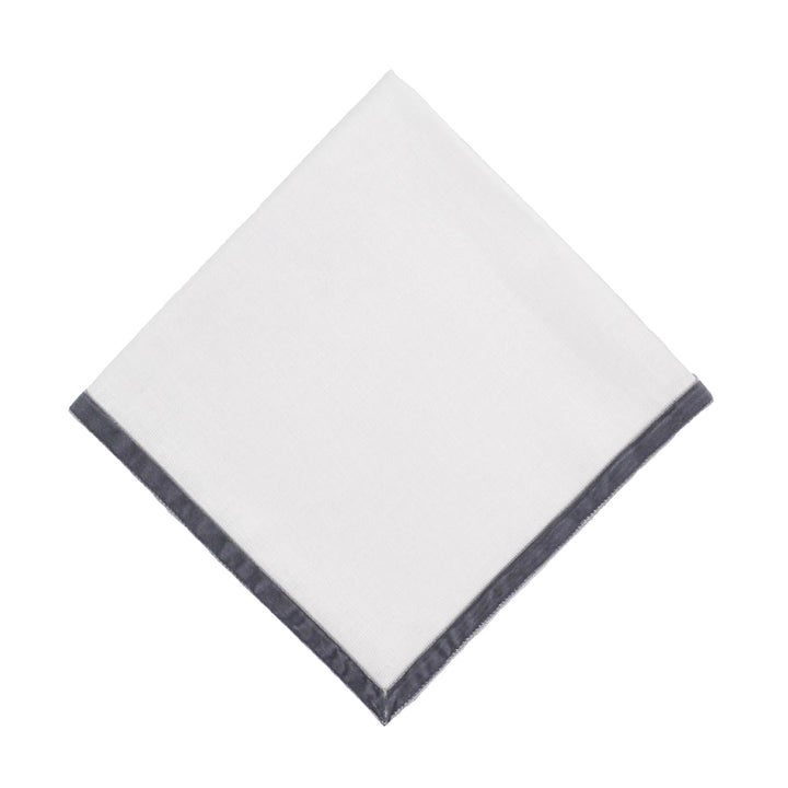 Single linen napkin square with dark velvet border, neatly folded