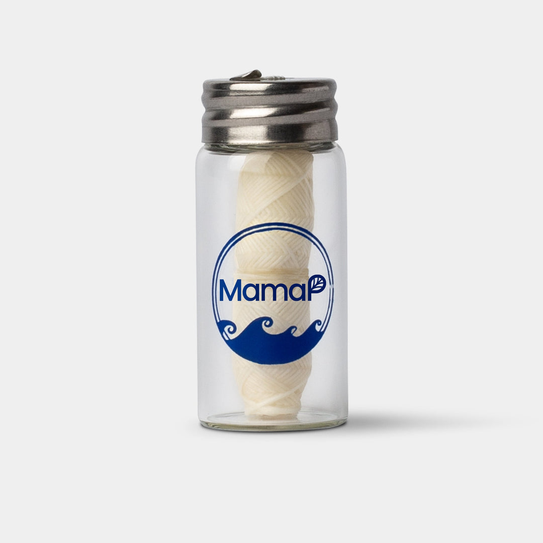 Reusable floss container with cream floss thread and metal snap lid
