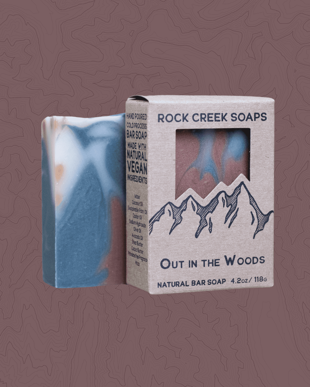 Natural vegan bar soap with blue-gray swirls, in cardboard gift box