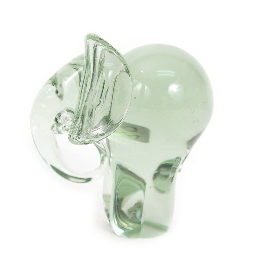 Recycled glass elephant figurine, green translucent side view with raised ears and trunk