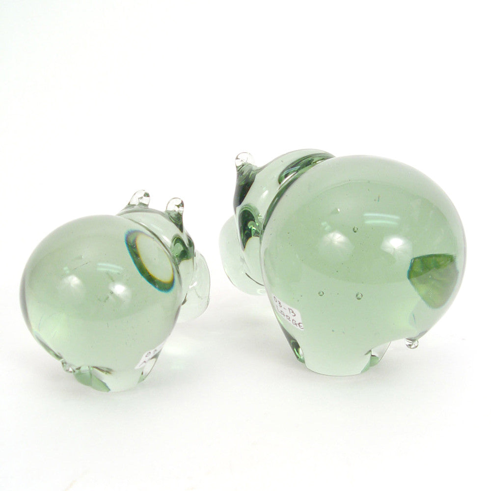 Green glass hippo figurines, front views with one large and one small hippo