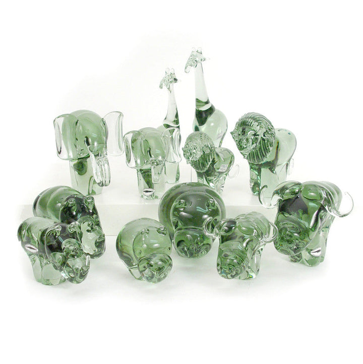 Assorted green recycled glass giraffe figurines, mixed sizes arranged in a group